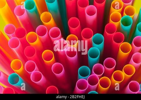 Colorful straws for beverage soft drink on colored background Stock Photo