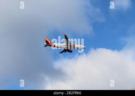 Berlin, Germany - February 07, 2019: easyJet plane in the sky approaching Berlin-Tegel Airport Stock Photo