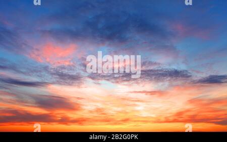 Sunset sky over the surface of the sea Stock Photo - Alamy