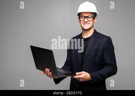 Portrait of an engineer using a laptop Stock Photo