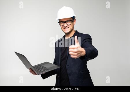 Portrait of an engineer using a laptop Stock Photo