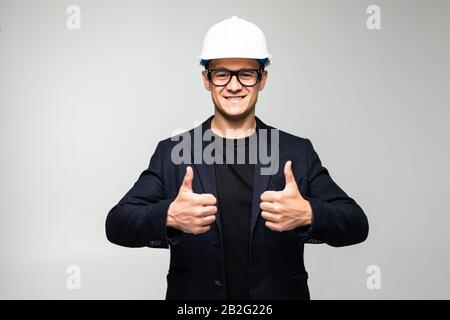 portrait of young positive manual worker thumbs up Stock Photo