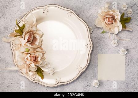 Elegant festive table setting with blank card in restaurant. Menu Invitation mockup. Stock Photo