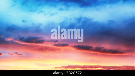 Only sky, dramatic sunset with colorful clouds Stock Photo