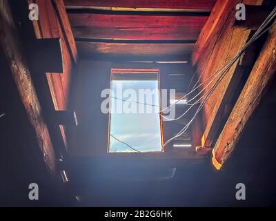 Old window with wires. View on sky from window. Vintage abstract background  Stock Photo