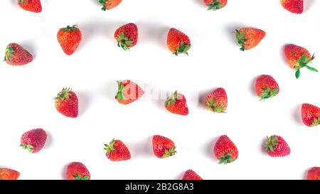 Place strawberries on white background., Top view. Flat lay pattern, a sweet soft red fruit with a seed-studded surface. Stock Photo