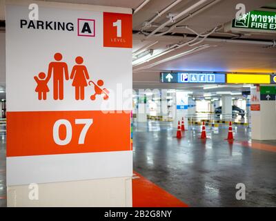 Parking in the mall. Parking space for families available Stock Photo