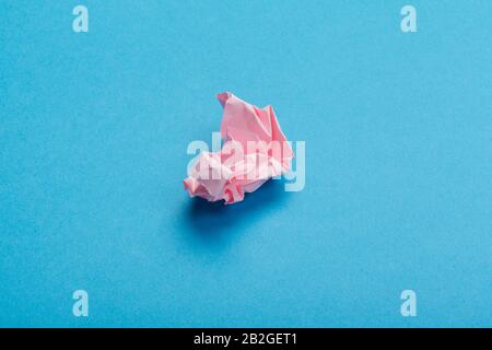 Wadded paper balls on a blue background Stock Photo