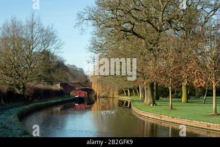 Scenic landscape of narrowboats moored on the Staffordshire & Worcester canal  in winter near Tixall lock west of Great Haywood junction in Staffordsh Stock Photo