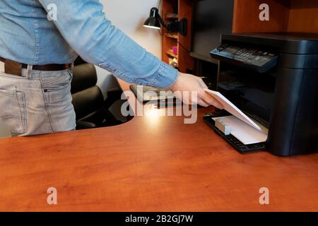 Reload paper to printer tray Stock Photo