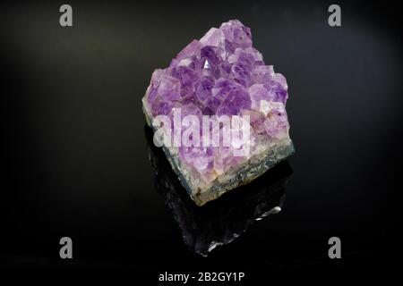 Amethyst crystals on black background Stock Photo