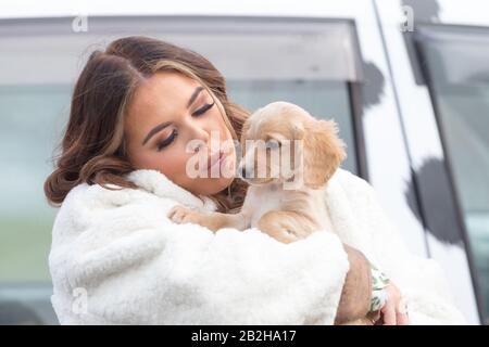 Birmingham NEC, UK. 3rd Mar, 2020. Scarlett Moffatt, star of Gogglebox and I'm a Celebrity, arrives at Crufts 2020, NEC Birmingham, with Biscuit, a Police Dog cocker puppy, to start preparations for the new Crufts Extra Youtube show. Crufts 2020 runs from 5th to 8th March. Credit: Peter Lopeman/Alamy Live News Stock Photo