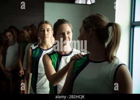 Female hockey players waiting on cloakroom Stock Photo