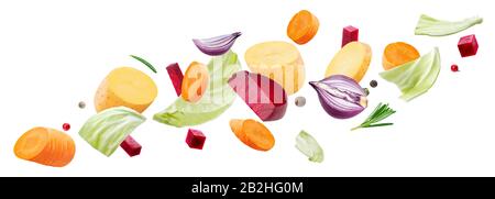 Falling pieces of different vegetables isolated on white background Stock Photo