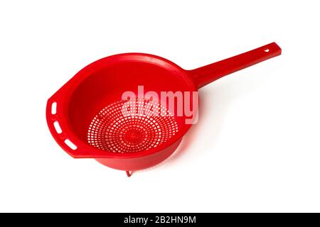Red plastic colander isolated on white Stock Photo