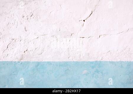 Abstract white and light blue detail adobe wall painted in Almagro Stock Photo