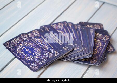 Vintage tarot cards on wooden blue table. Stock Photo