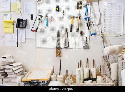 Assorted workshop tools on a pegboard Stock Photo