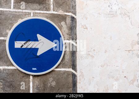 One way traffic sign on old wall of La Vera street in Guia de Isora, Tenerife, Canary Islands, Spain Stock Photo