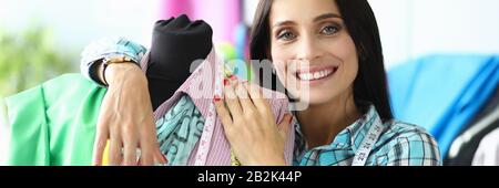 Smiling creative fabric worker Stock Photo