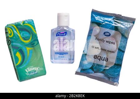 Bottle of Purell hygienic hand rub, hand gel, hand sanitiser with packet of Kleenex balsam + menthol tissues and Boots aqua handy wipes moist tissues Stock Photo