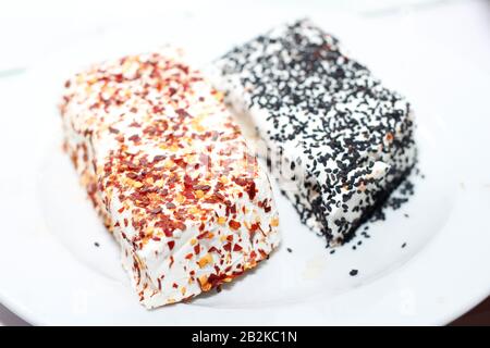 Trays full of slices of cheese Stock Photo