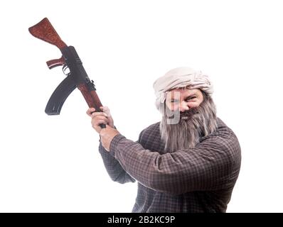 The bearded man attack with kalashnikov isolated on a white background. Emotional warrior wants to hit enemy with automatic weapon. Stock Photo