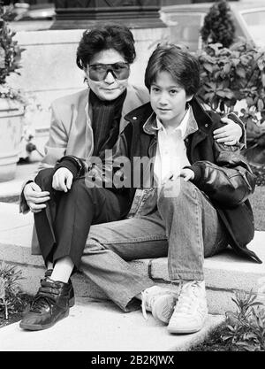 John Lennon's widow Yoko Ono in London with their son, Sean. Yoko is to play a concert at Wembley on her 'Star Peace' tour. Stock Photo