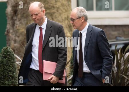 (200303) -- LONDON, March 3, 2020 (Xinhua) -- Chief Medical Officer for England Chris Whitty (L) and UK Government Chief Scientific Adviser Patrick Vallance arrive at Downing Street to attend a press conference on the government's coronavirus action plan in London, Britain, March 3, 2020. (Photo by Ray Tang/Xinhua) Stock Photo
