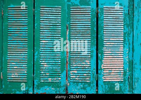 Vintage, vintage shutters on the Windows of green color on the whole screen. As a texture background Stock Photo