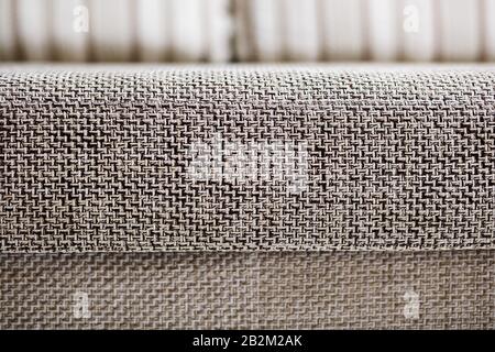 Closeup of a fragment of a beige textile sofa in the room. Texture of expensive fabric on furniture. Sofa element couch couch room furniture Stock Photo