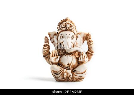 Hindu god Ganesh on a black background. Statue with incense smoke aromo sticks. Copy space Stock Photo