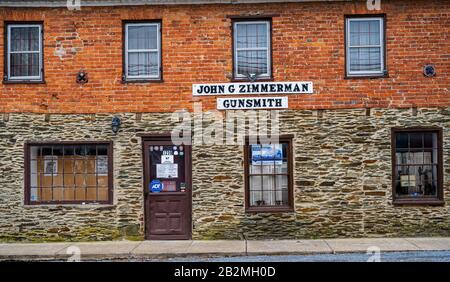 Harpers Ferry, West Virginia, USA — March 2, 2020. Photo of the exterior of a store housing a registered gunsmith in the small town of Harpers Ferry, Stock Photo