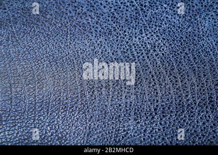 Blue textured leather reptiles, used texture for the background. Lizard or crocodile skin. Full screen, top view Stock Photo