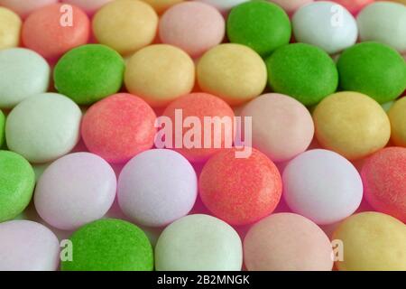 Lined Up Multi-color Round Shaped Candies for Background or Banner Stock Photo