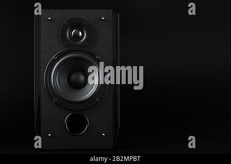 Multimedia speaker column on a black background. Free space for text. Powerful and clear sound Stock Photo