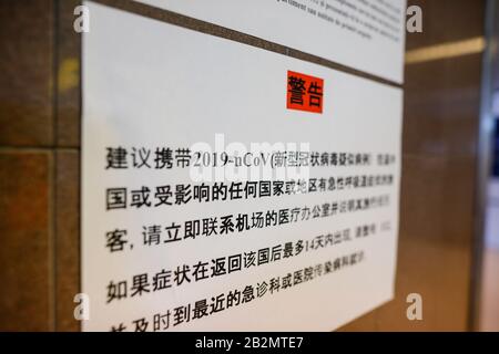 Otopeni, Romania - February 25, 2020: Text inside the Henri Coanda International airport regarding the coronavirus. Stock Photo