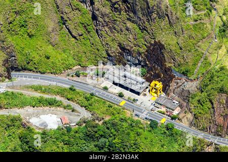 Aerial view of a power substation nestled within a dense forest during ...