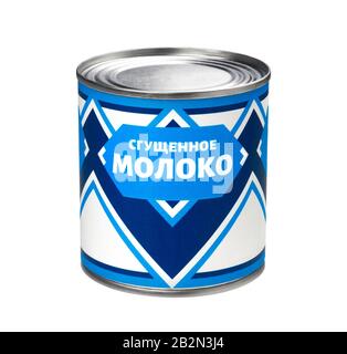 Condensed milk can isolated on white background, russian cyrillic text Stock Photo