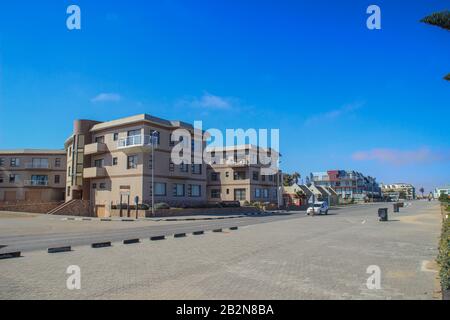 Swakopmund, Namibia - April 18, 2015: modern buildings and architecture: houses, shops and road in an African city
