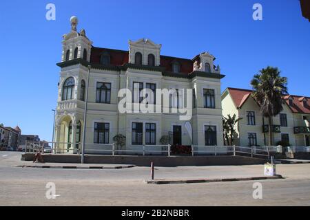 Swakopmund, Namibia - April 18, 2015: Old-time German buildings and architecture: houses, shops and road in an African city Stock Photo