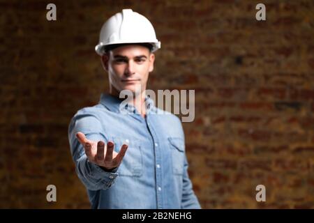Caucasian male architect engineer holding a digital tablet Stock Photo