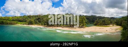 Aerial panoramic image off the coast over Kalihawai beach on Hawaiian island of Kauai Stock Photo