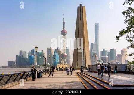 SHANGHAI, CHINA, OCTOBER 29: View of the Monument to the People's Heroes along the Bund riverside area with the city Skyline in the distance on Octobe Stock Photo
