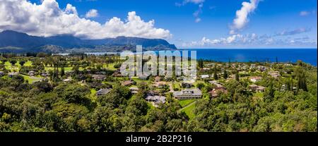 Aerial panorama of Princeville and Bali Hai with Hanalei Bay in Kauai in the distance Stock Photo