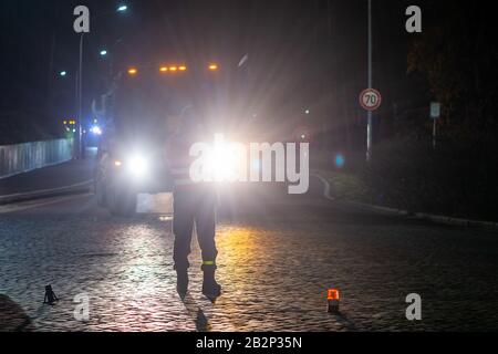 03 March 2020, Saxony-Anhalt, Burg: A soldier of Logistics Battalion 171 instructs US Army vehicles to enter the gate of Clausewitz Barracks. The military vehicle will be transferred from a depot in Belgium to Poland for the US-led exercise 'Defender Europe 2020'. On their way through Saxony-Anhalt the military convoys stop at the Clausewitz barracks to refuel. Around 37,000 soldiers from 18 nations will participate in the exercise. In the coming weeks, the US military is moving around 1,500 vehicles to Poland, which are to be refuelled in the Clausewitz barracks. Photo: Klaus-Dietmar Gabbert/ Stock Photo