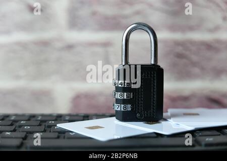 close of padlock and credit card on keyboard  Stock Photo