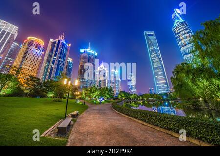 SHANGHAI, CHINA, OCTOBER 30: Central Green Space Park with views of city skyscraper in the Lujiazui financial district at night on October 30, 2019 in Stock Photo