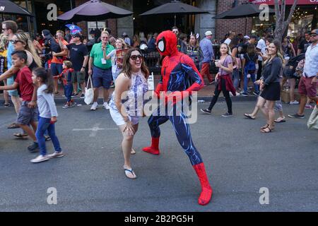 People wearing costumes, taking photos in the street next to the San Diego Comic-Con International, Comic book convention in San Diego, California, United States. July 23rd, 2019  Stock Photo