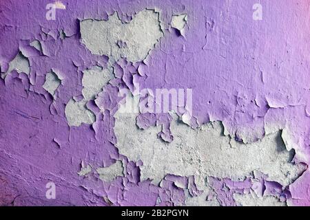 Close up of old stucco cracks on the wall. Weathered paint cracks on plaster. Cracked wall background. Abstract Web Banner Stock Photo